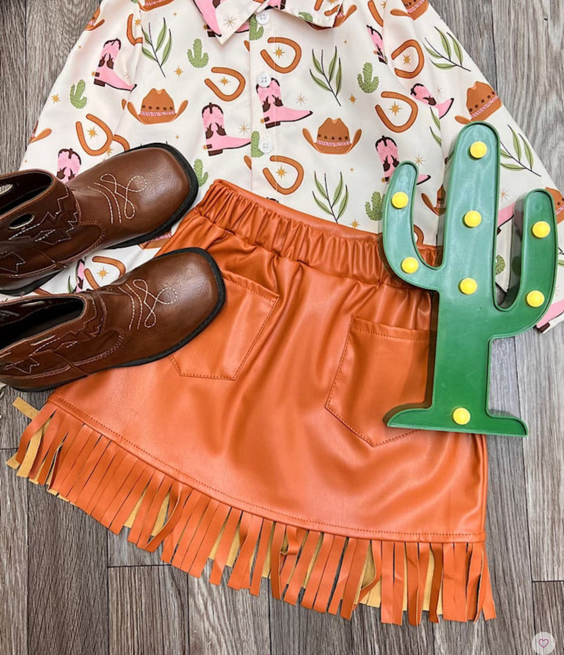 FAUX LEATHER FRINGE HEM SKIRT