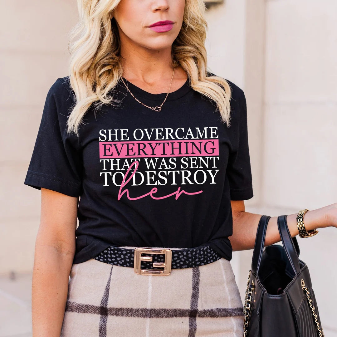 Womens “She Overcame Everything That Was Sent To Destroy Her” Graphic Tee.