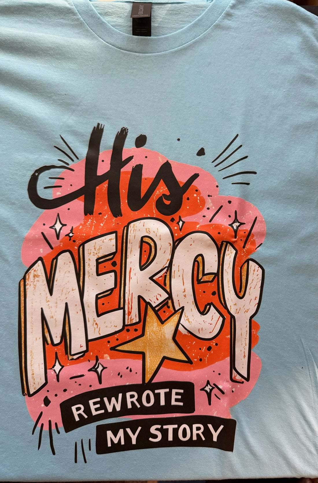 His Mercy Rewrote My Story Graphic Tee