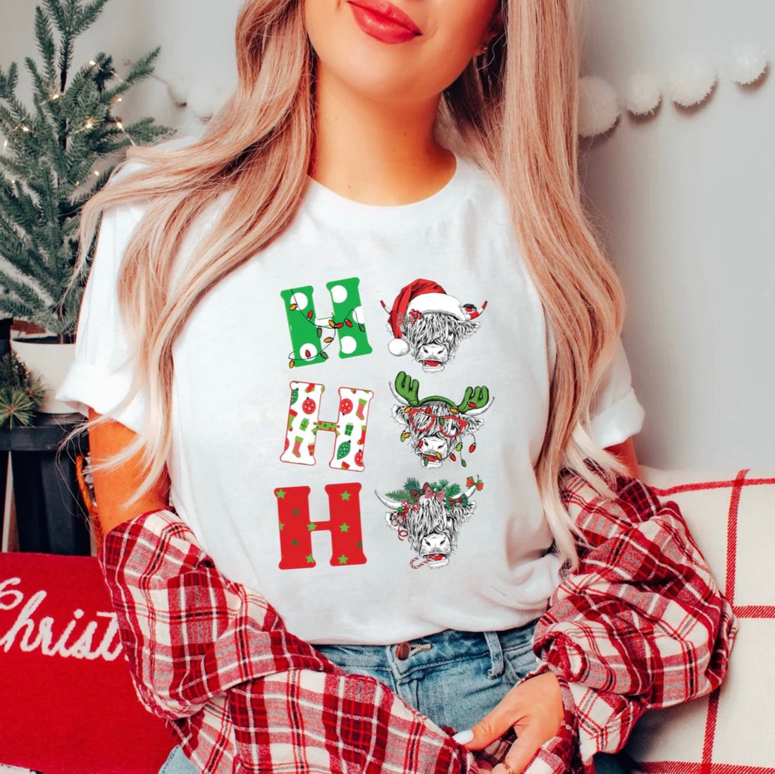 ‘’Ho Ho Ho” Christmas Highland Cow Graphic Tee.