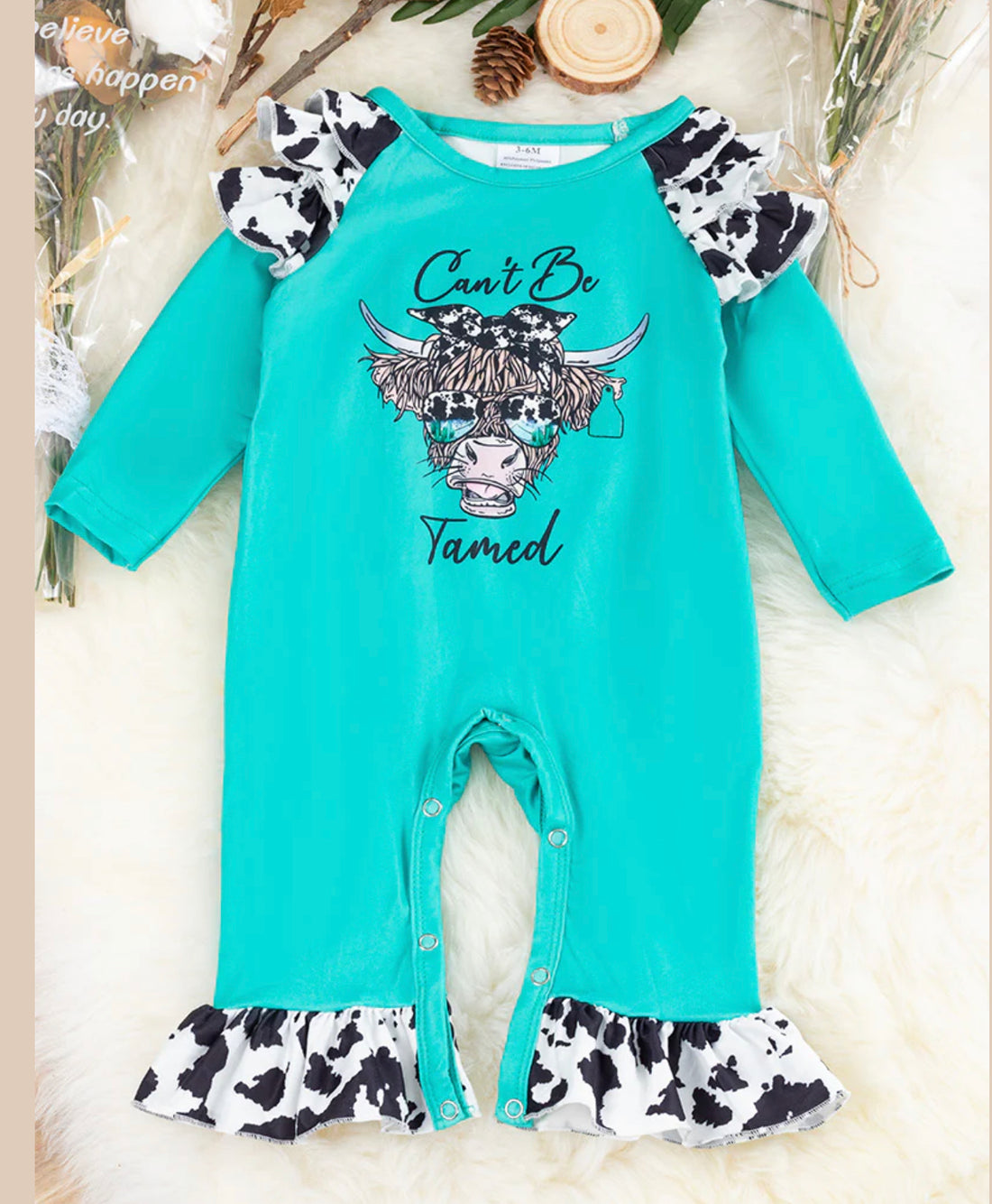 ‘’Can’t Be Tamed” Cow Print Baby Romper with Ruffle Detail