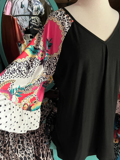 Stylish Black Top with colorful pink, white and black cheetah bell sleeves