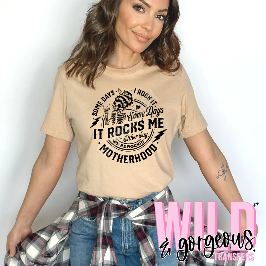 Womens “Some Days I Rock It, Some Days It Rocks Me, Either Way We’re Rockin’ Motherhood”. Graphic Tee