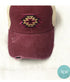 Front View of Maroon-Distressed Aztec Messy Bun Cap