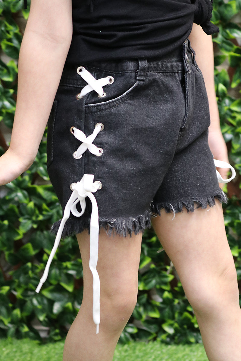 Front View- Girls Black Crisscross Detail Denim Shorts with Frayed Hem